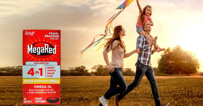 Family running through a field with a kite