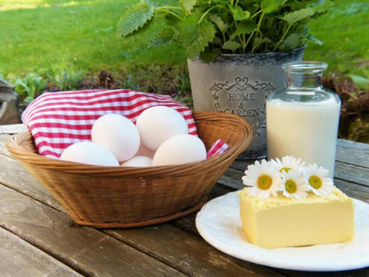 Eggs, milk and cheese on a table