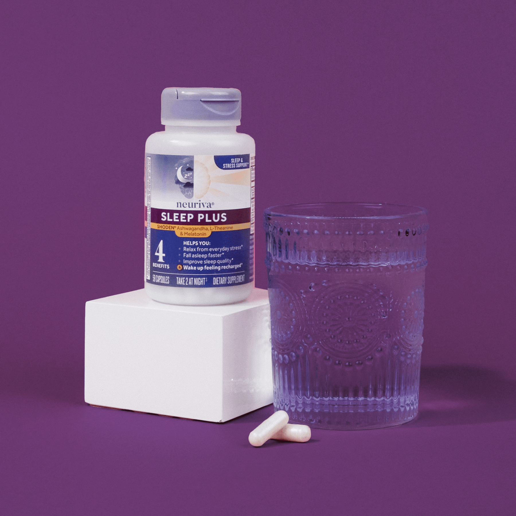 Neuriva Sleep Plus bottle next to a glass of water
