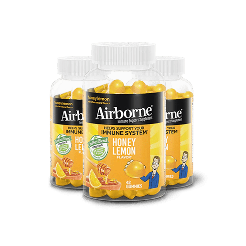 Three bottles of Airborne Honey Lemon capsules
