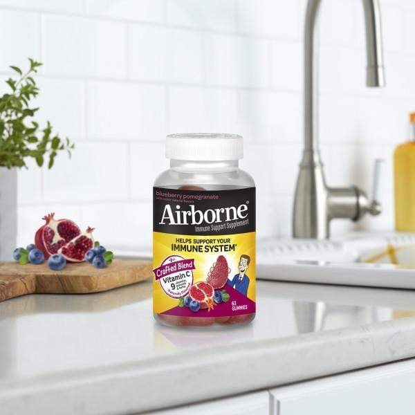 Airborne Immune Support Strawberry Pomegranate Gummies on kitchen counter 
